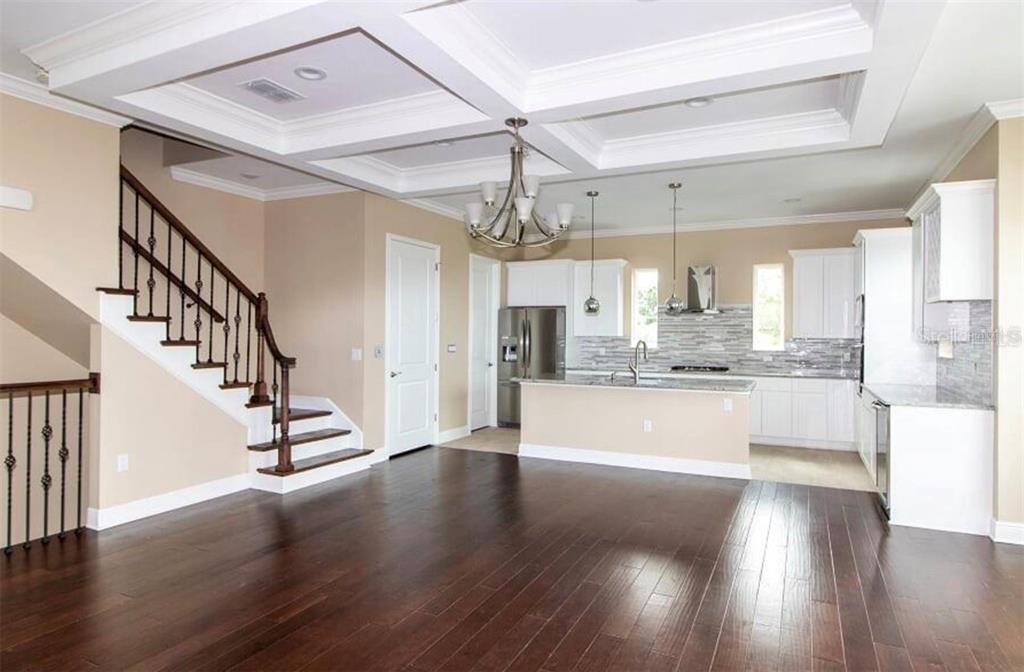 3702 West Roland Street, Unit 13 Tampa, FL 33609 - Photo 3 of 10 a view of an entryway with wooden floors
