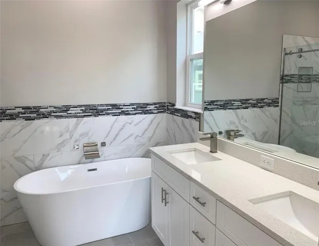 a bathroom with a bathtub and a sink