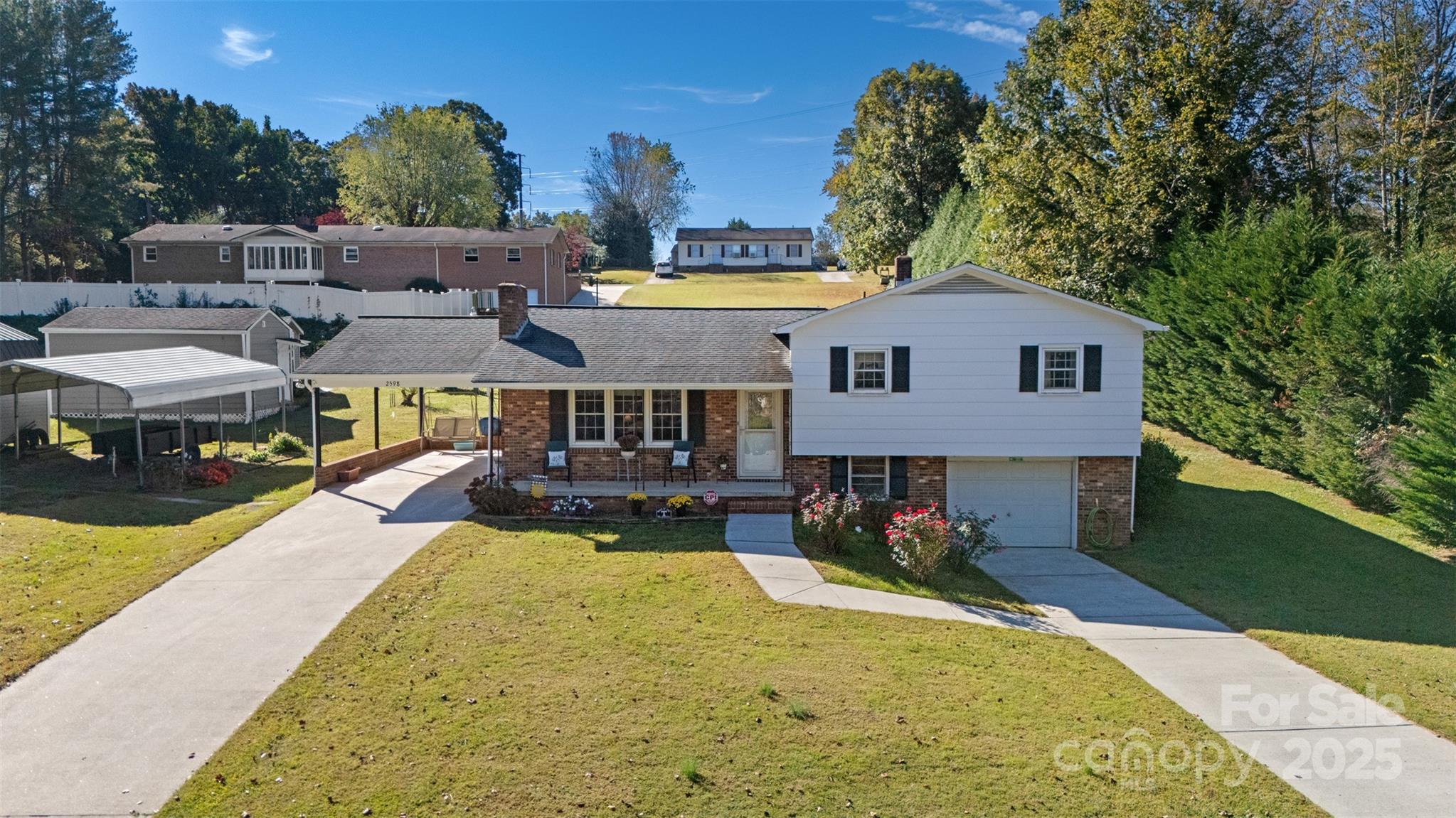 2598 Conner Circle Lenoir, NC 28645 - Photo 1 of 44 a view of a house with swimming pool and sitting area