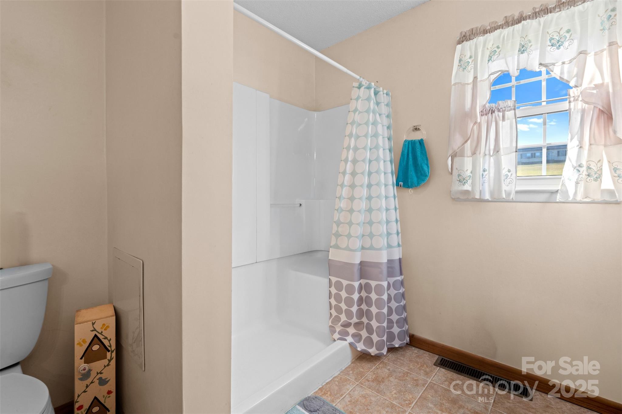 2598 Conner Circle Lenoir, NC 28645 - Photo 18 of 44 a bathroom with a toilet and shower