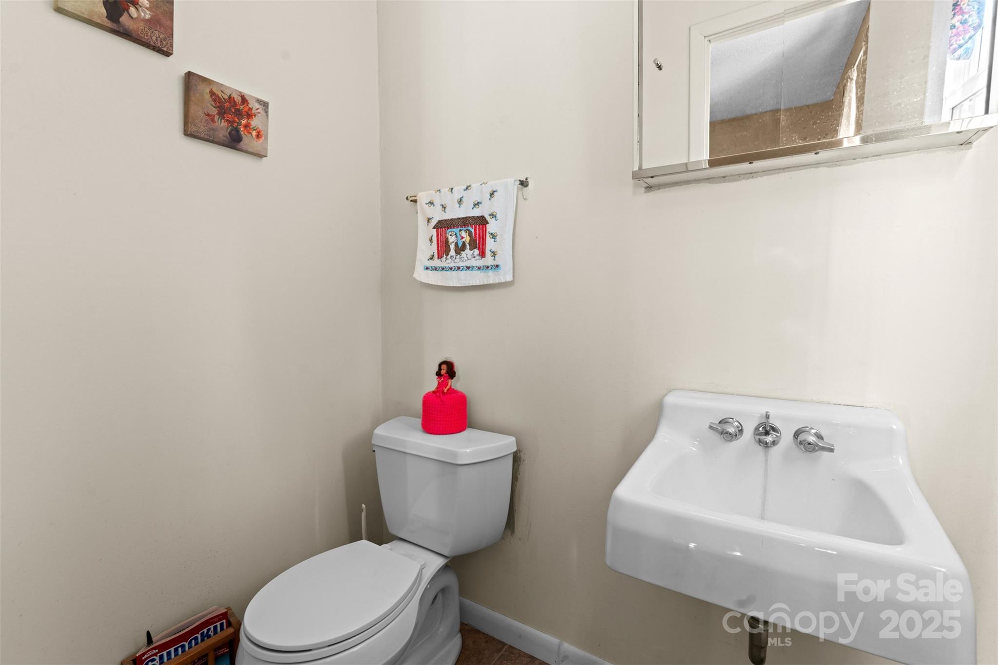 2598 Conner Circle Lenoir, NC 28645 - Photo 24 of 44 a white toilet sitting next to a bathroom sink