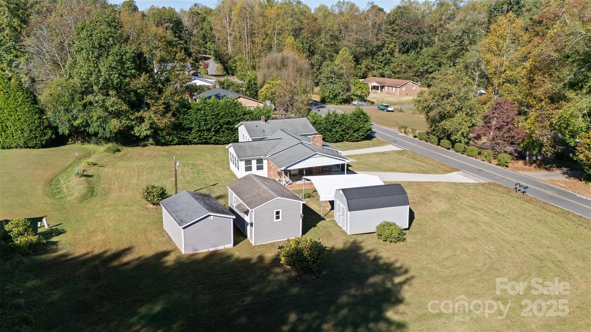 2598 Conner Circle Lenoir, NC 28645 - Photo 30 of 44 an aerial view of a house with swimming pool and garden