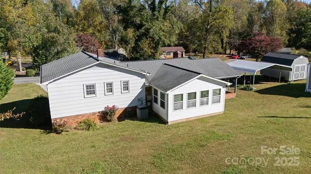 a front view of a house with yard and green space