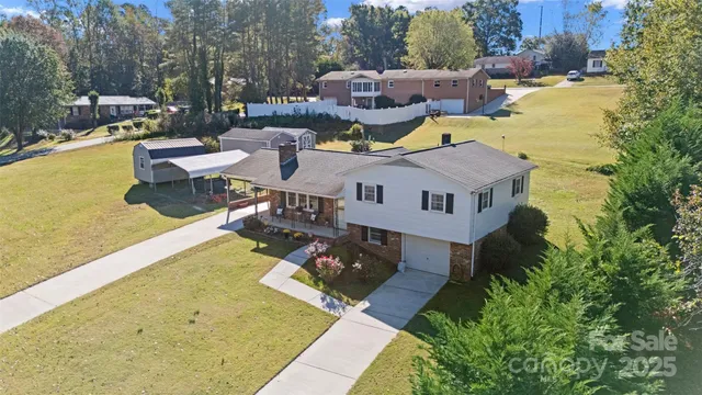 a swimming pool with outdoor seating and yard
