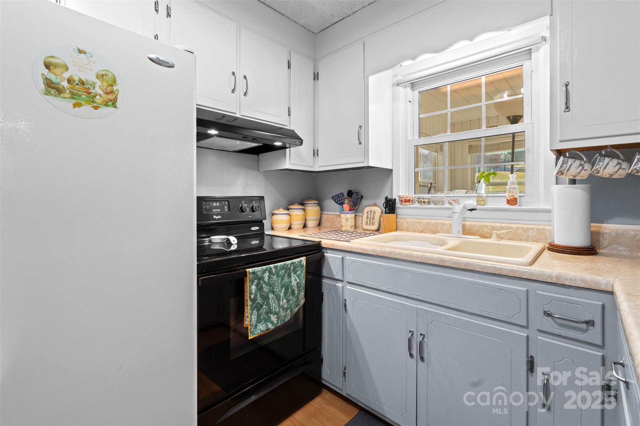 2598 Conner Circle Lenoir, NC 28645 - Photo 6 of 44 a kitchen with stainless steel appliances granite countertop a sink a stove and a window