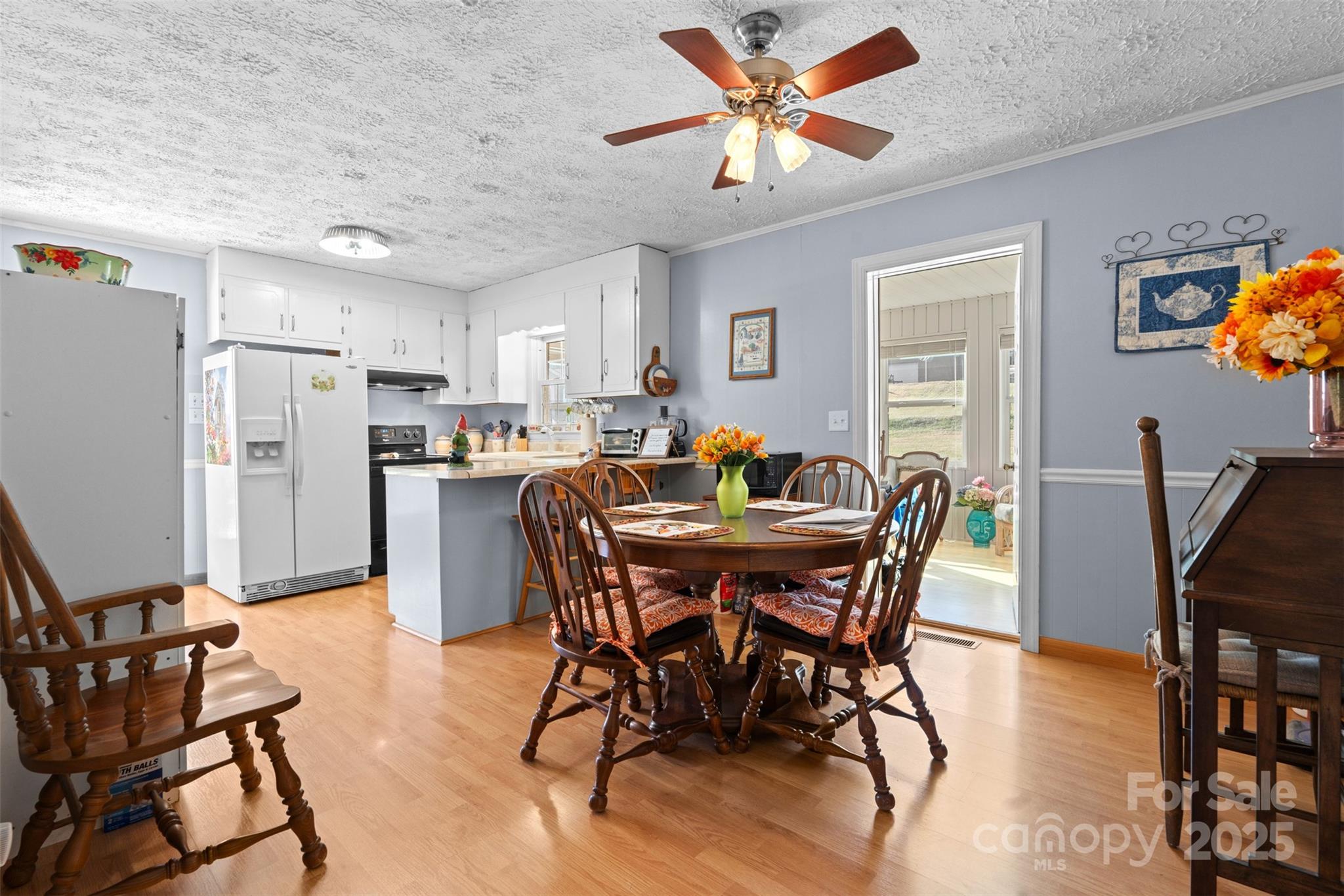 2598 Conner Circle Lenoir, NC 28645 - Photo 9 of 44 a view of a dining room with furniture and a kitchen