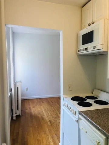 a kitchen with a stove and a microwave