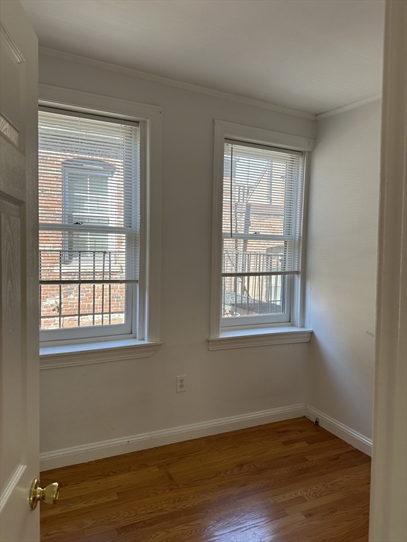 17 South Russell Street, Unit 8 Boston, MA 02114 - Photo 10 of 11 a view of an empty room with wooden floor and a window