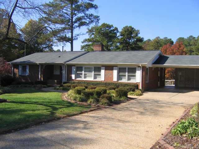 812 Merwin Road Raleigh, NC 27606 - Photo 1 of 1 a front view of a house with a garden