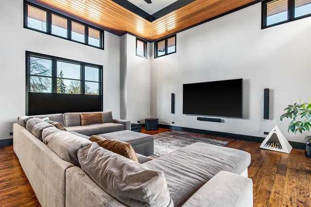 a view of a livingroom with furniture and hardwood floor