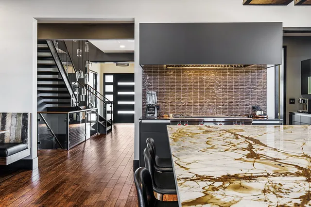 a view of a living room with furniture and floor to ceiling window