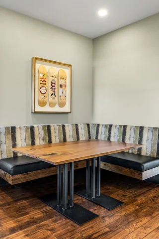 a view of a living room with a balcony wooden floor and furniture