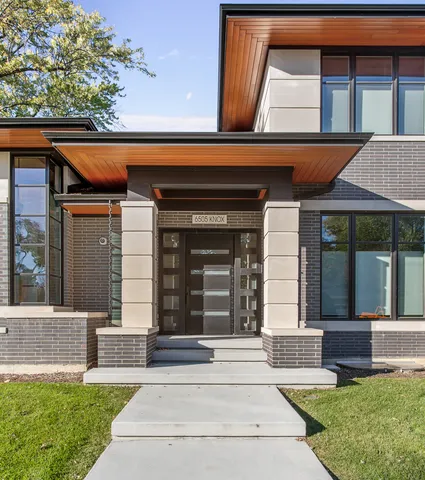 a view of a house with a yard and deck