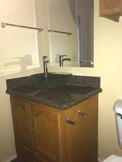 2213 West Candlelight Lane, Unit 4 Edinburg, TX 78541 - Photo 12 of 15 Bathroom featuring vanity and toilet