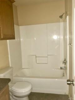 2213 West Candlelight Lane, Unit 4 Edinburg, TX 78541 - Photo 13 of 15 Bathroom featuring vanity and shower combination