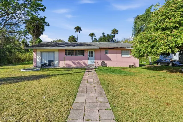a front view of house with yard and seating area