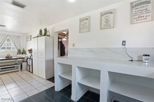 a kitchen with a refrigerator and countertop