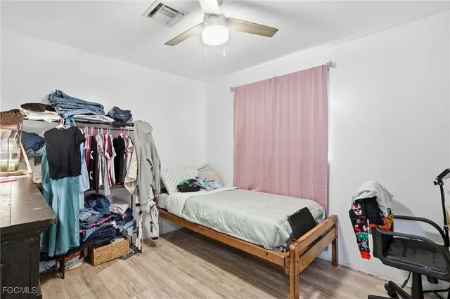 a bedroom with a bed and a desk