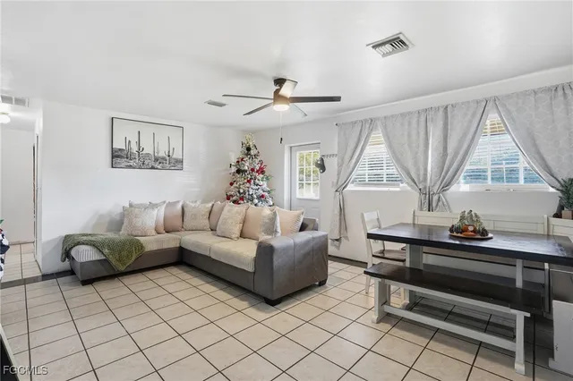 a living room with furniture and a window