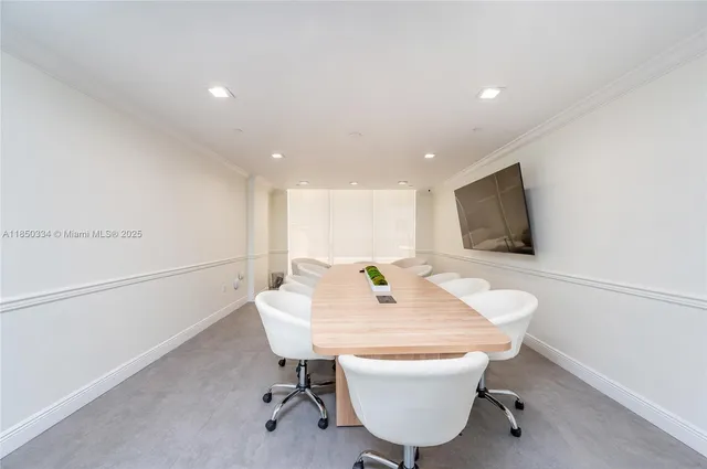 a room with a table and chairs