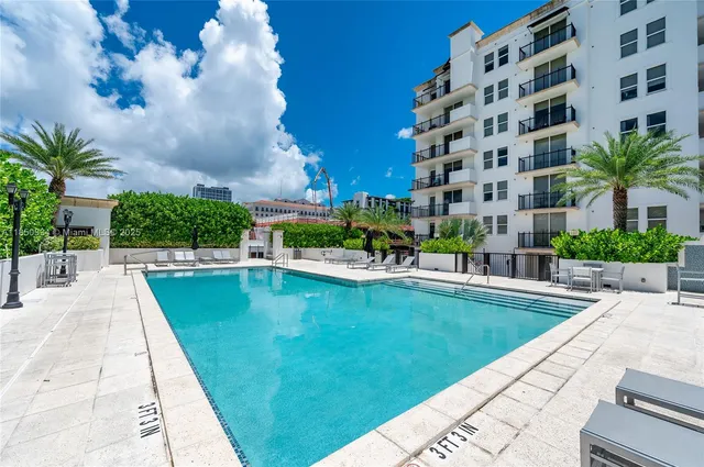 a view of a swimming pool with a patio