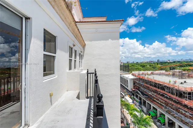 a view of a balcony with wooden floor and city view