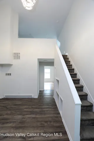 a view of a hallway with staircase