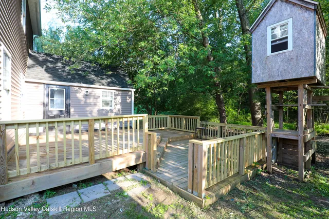 a view of a wooden fence and a yard