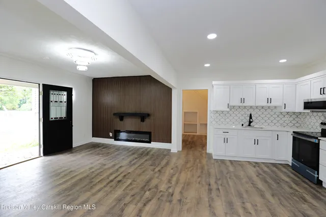 a view of a kitchen with a sink and a stove