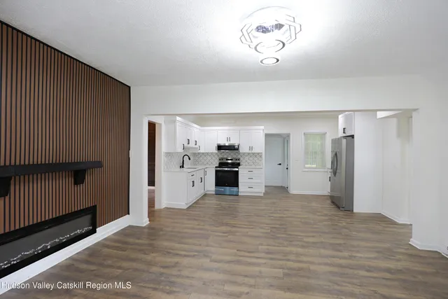 a view of a kitchen with a sink