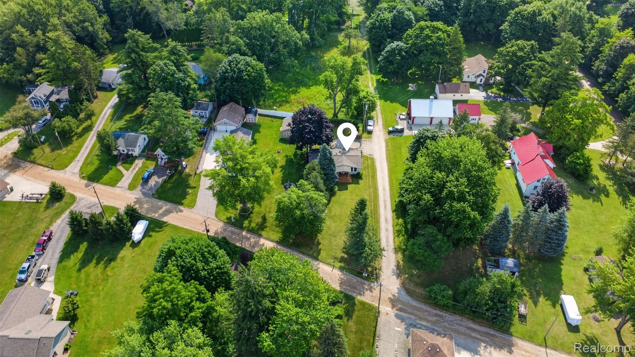 5977 Anglers Road Ortonville, MI 48462 - Photo 2 of 63 Property situated on a corner lot with mature trees and established landscaping