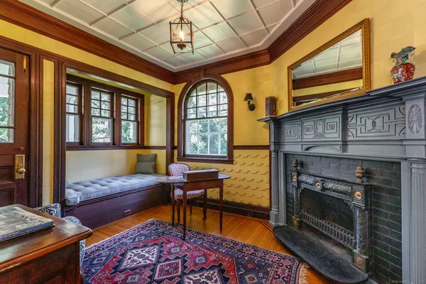 a living room with furniture fireplace and flat screen tv
