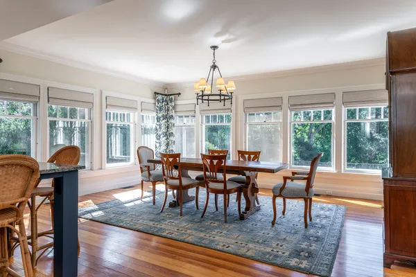 a view of a dining room with furniture window and outside view