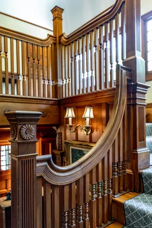 a front view of a house with wooden deck