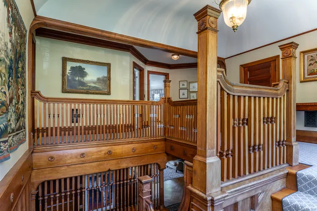 a view of a house with a wooden deck