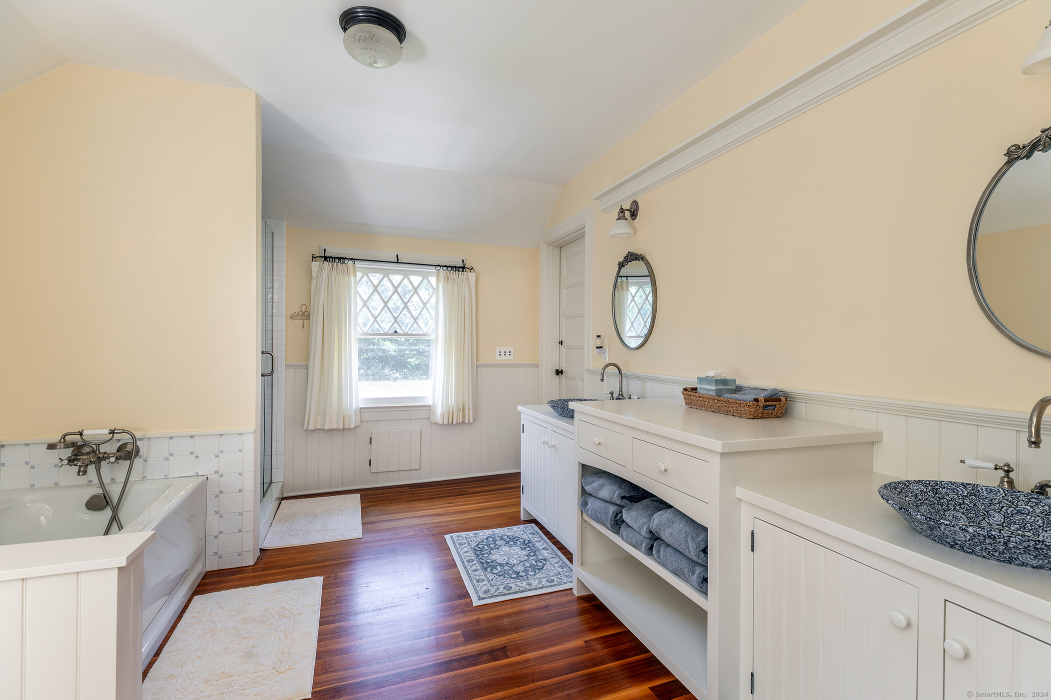 51 Ferry Bridge Road Washington, CT 06793 - Photo 26 of 36 a spacious bathroom with double vanity and a mirror