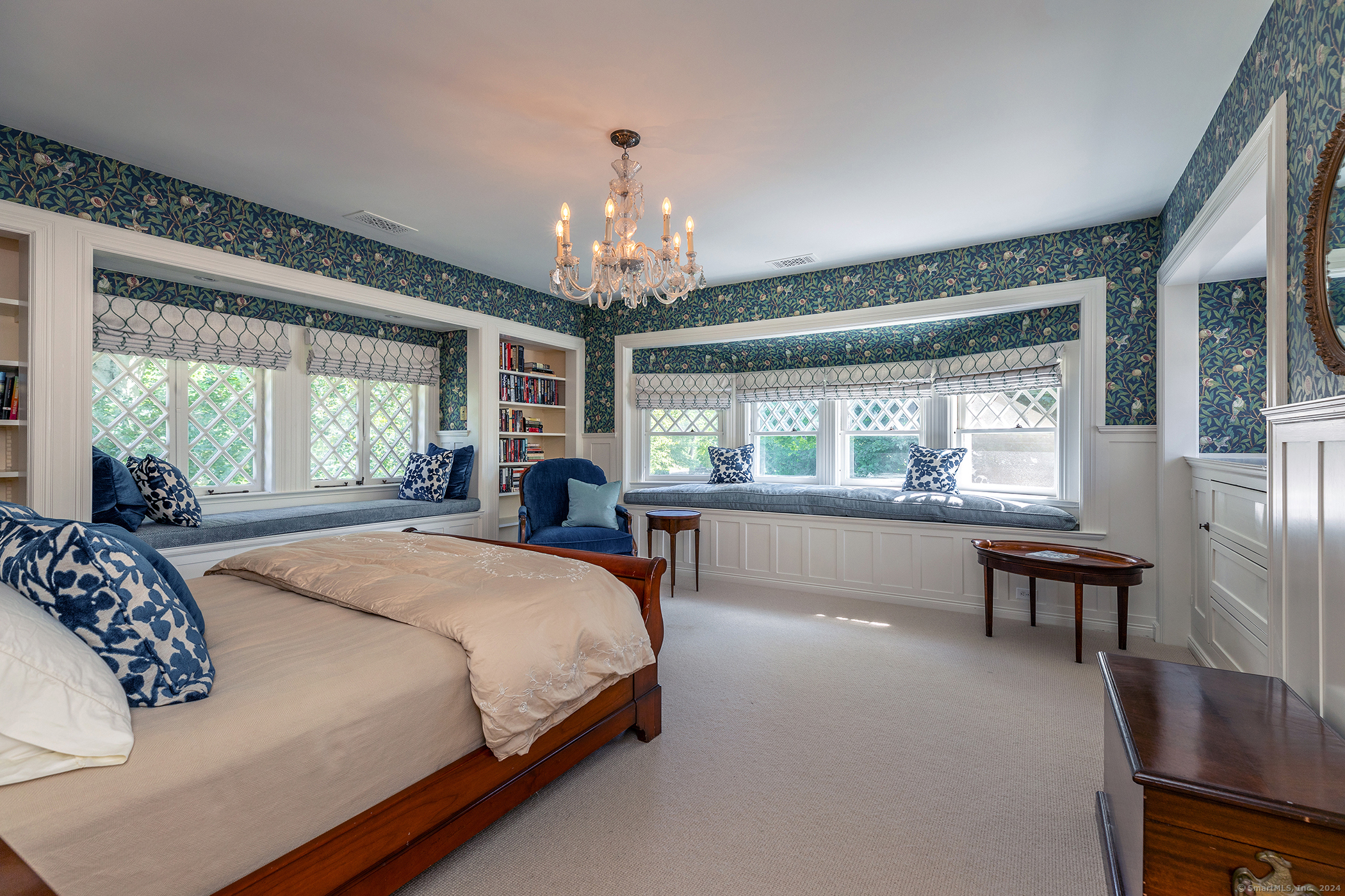51 Ferry Bridge Road Washington, CT 06793 - Photo 27 of 40 a spacious bedroom with a large bed and a chandelier