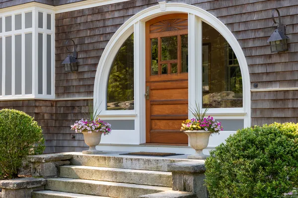 a front view of a house with a yard