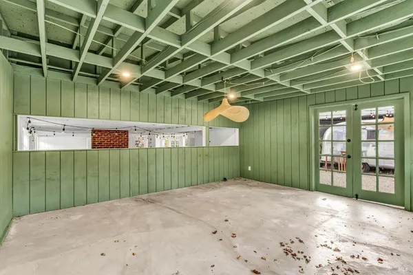 a view of a balcony with chairs and a table
