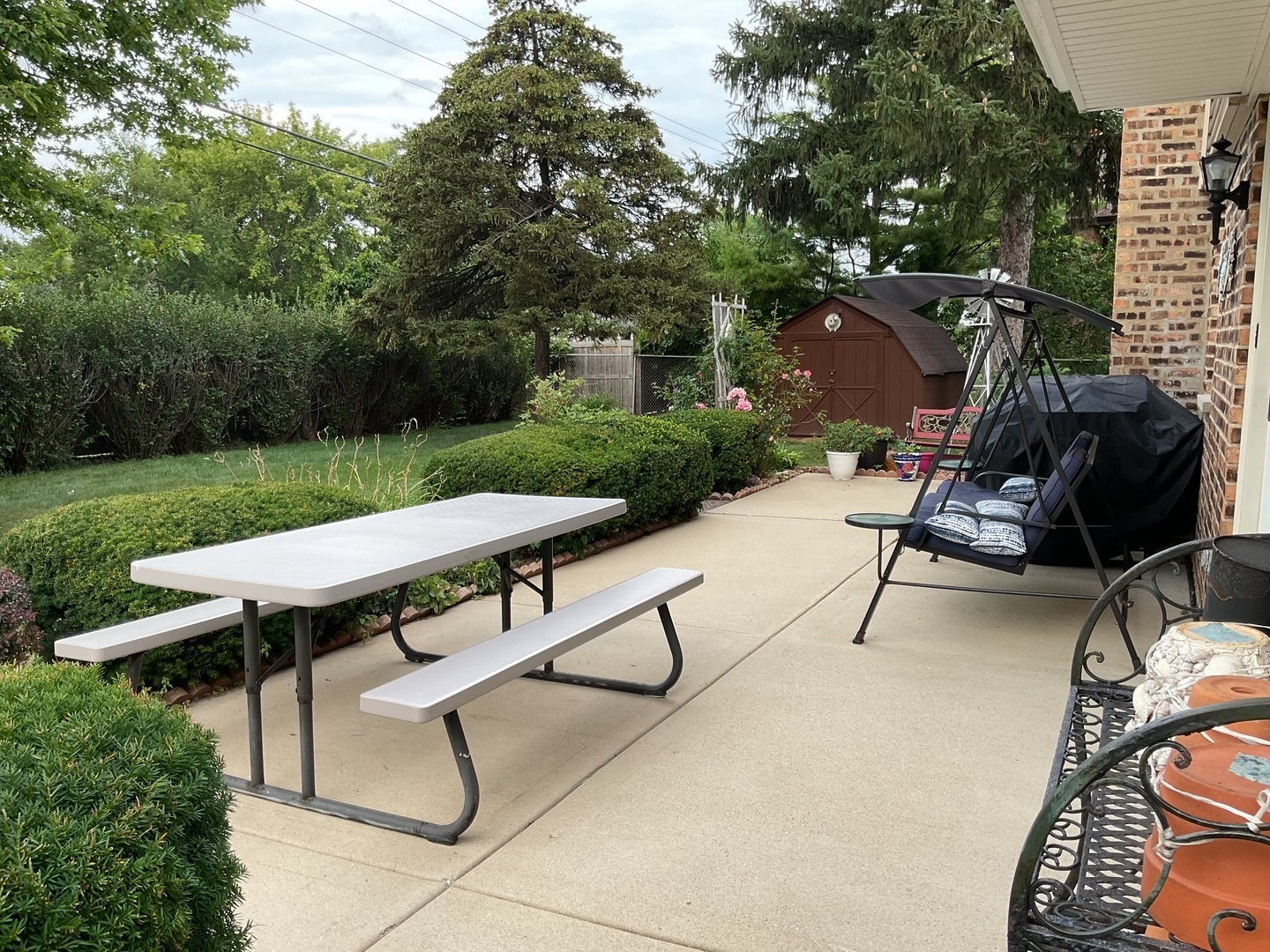 1200 West Palm Drive Mount Prospect, IL 60056 - Photo 5 of 36 a view of a patio with a table chairs and a grill