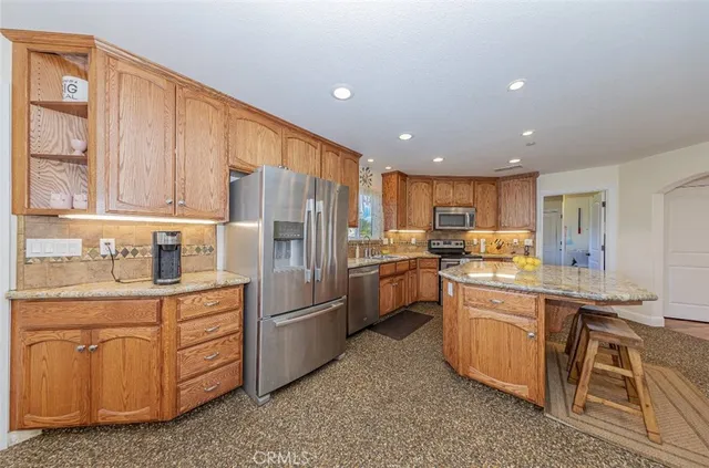 a bathroom with a tub a double vanity sink and a mirror