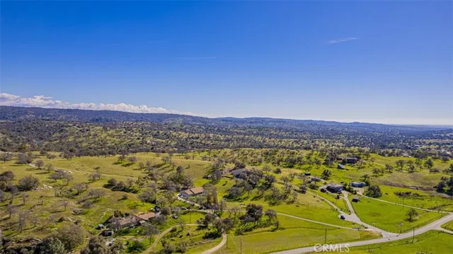 a kitchen with stainless steel appliances granite countertop a refrigerator a stove a sink and a refrigerator