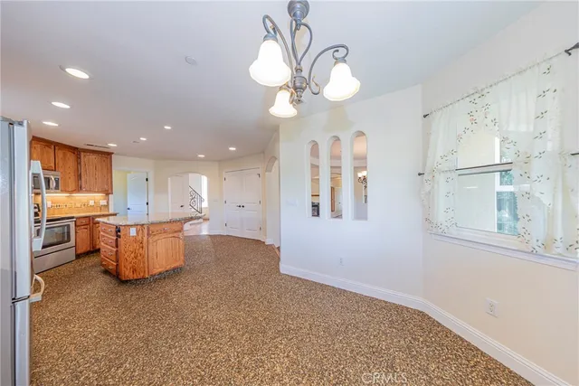 a bathroom with a granite countertop double vanity sink and a mirror