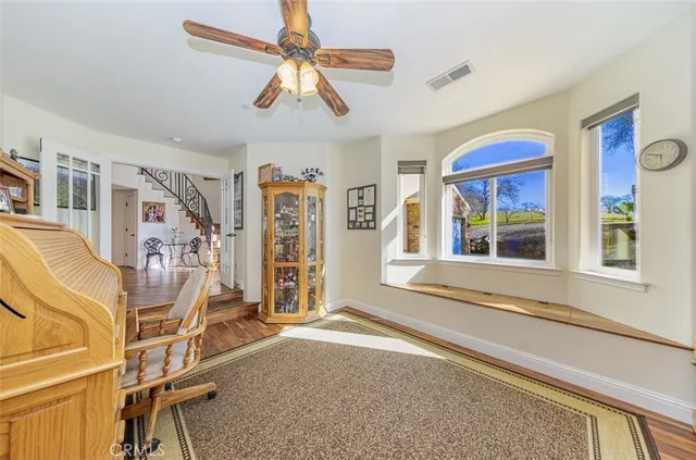 a bed room with a bed mirror and a window