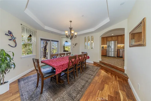 a kitchen with stainless steel appliances granite countertop a sink a stove and cabinets