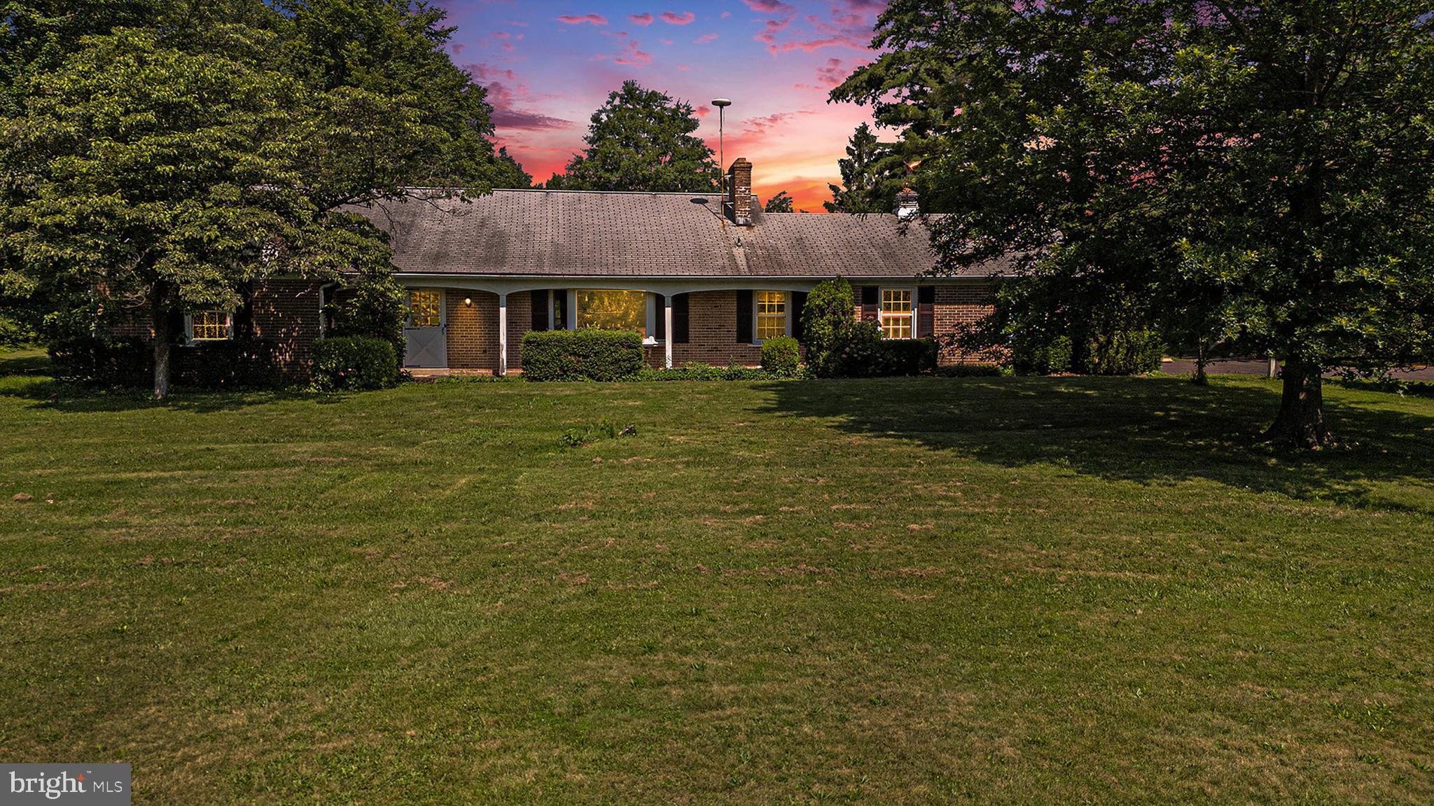 2218 Upper Stump Road Perkasie, PA 18944 - Photo 1 of 10 a front view of a house with a garden