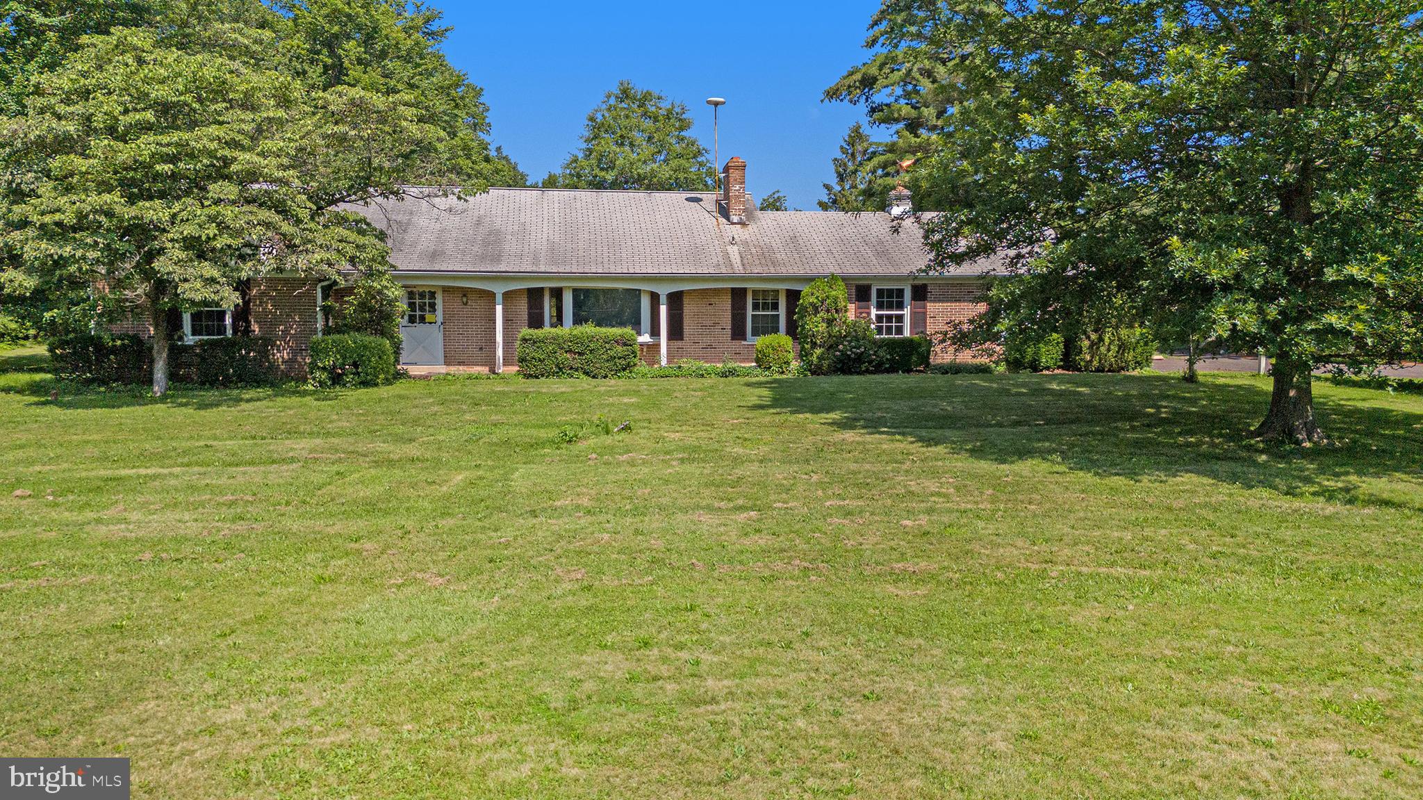 2218 Upper Stump Road Perkasie, PA 18944 - Photo 4 of 10 a front view of a house with a garden