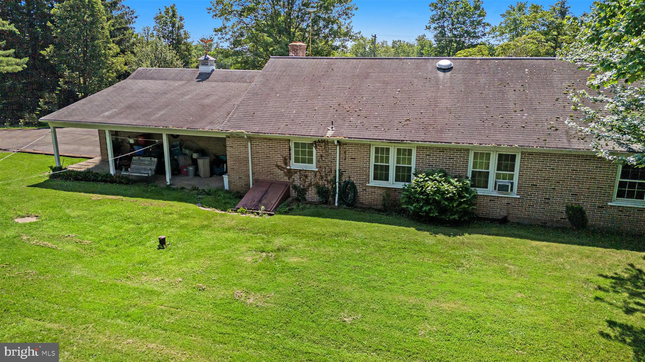 2218 Upper Stump Road Perkasie, PA 18944 - Photo 6 of 10 a view of a house with a backyard and a garden