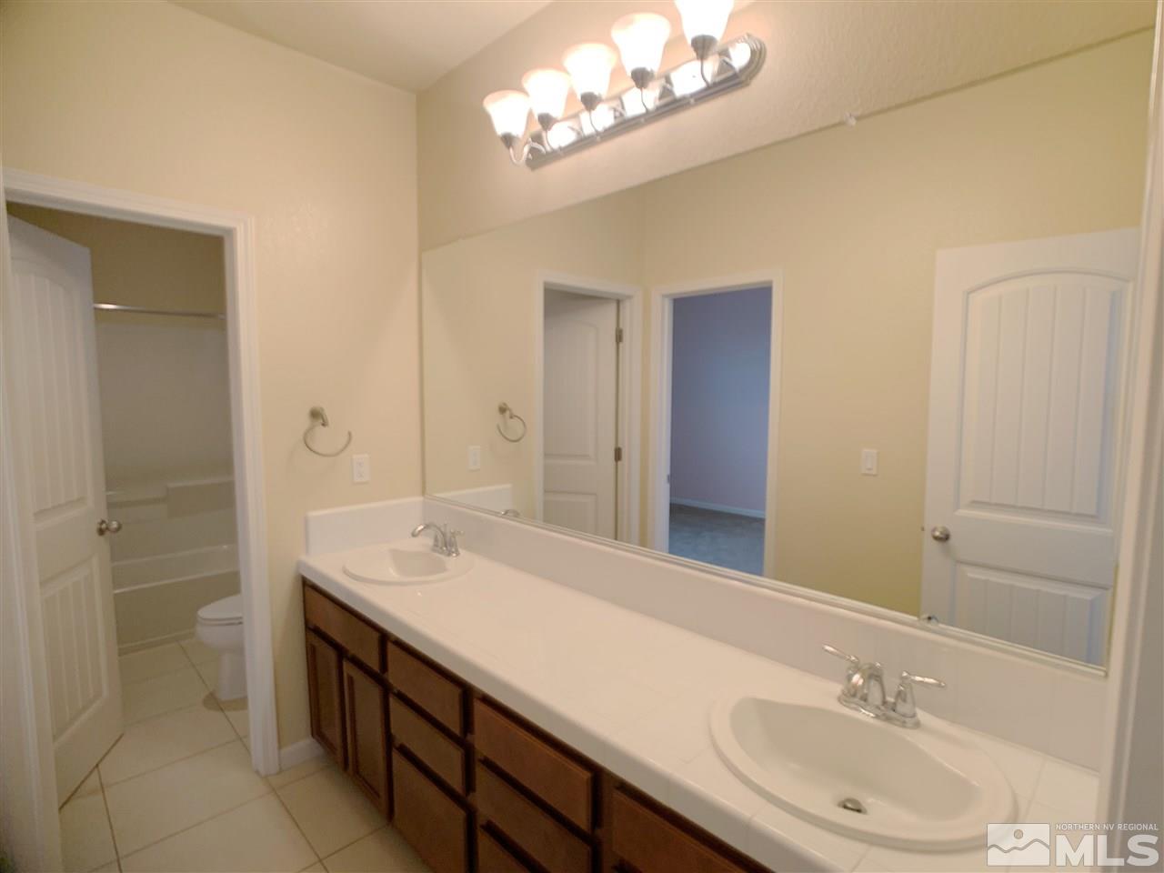2160 Bears Ranch Drive Reno, NV 89521 - Photo 8 of 12 a bathroom with a sink double vanity and a mirror