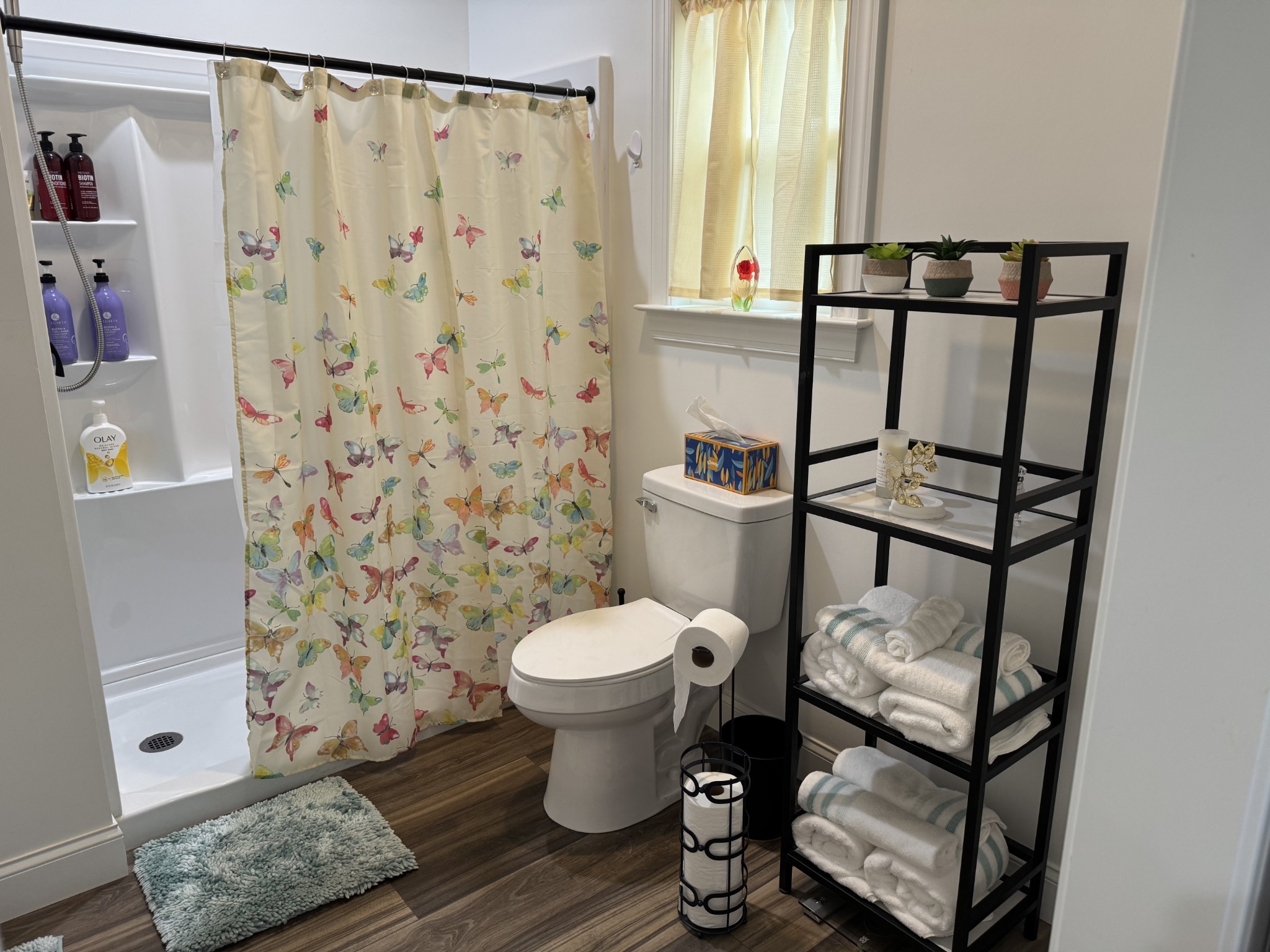 662 Ketner Mill Road Whitwell, TN 37397 - Photo 13 of 26 a bathroom with a toilet and a shower curtain